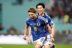 Japan's Ritsu Doan celebrates its goal against Germany.