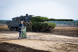 Germany's Chancellor Olaf Scholz gives speeches to soldiers in front of a tank of type Leopard 2 in the German Ostenholz in October 2022.